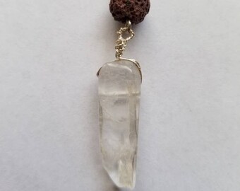 Polished quartz crystal and brown unwaxed lava bead on an optional 18 inch sterling silver necklace