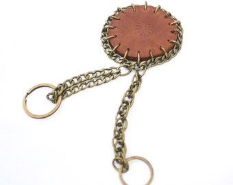 Embossed leather with a metal chain keyring