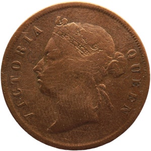 May include: A copper coin featuring a profile of Queen Victoria on the obverse. The coin reads "VICTORIA" on the left side and "ONE PENNY" on the right side.