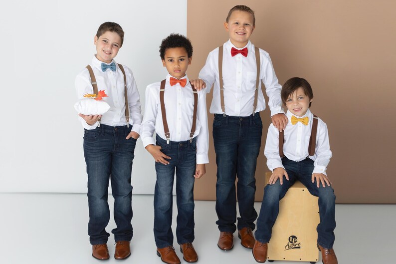 Boys wearing a variety of Armoniia bow ties and suspenders including steel blue bow tie