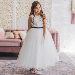 Girl in a white navy beaded dress
