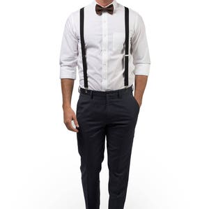 Man wearing black suspenders & brown bow tie