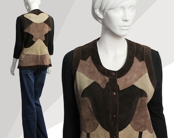 May include: A brown suede vest with a patchwork design. The vest has a button closure and a round neckline.