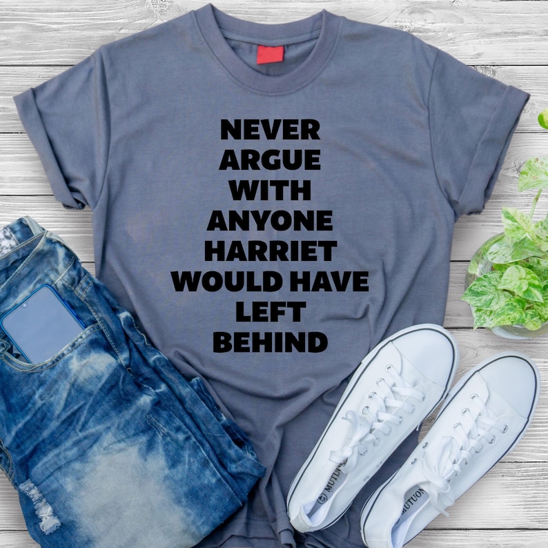 May include: A gray t-shirt with the text "Never argue with anyone Harriet would have left behind" printed in black.