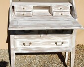 Vintage French drop front desk with neat small drawers inside and 4 good drawers beneath. Good condition. Chalky white patina.