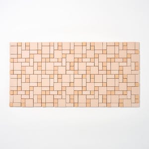 May include: A rectangular wall art piece with a geometric pattern. The design features a mosaic of various sized squares and rectangles in shades of beige and light brown. The artwork is displayed against a white background.