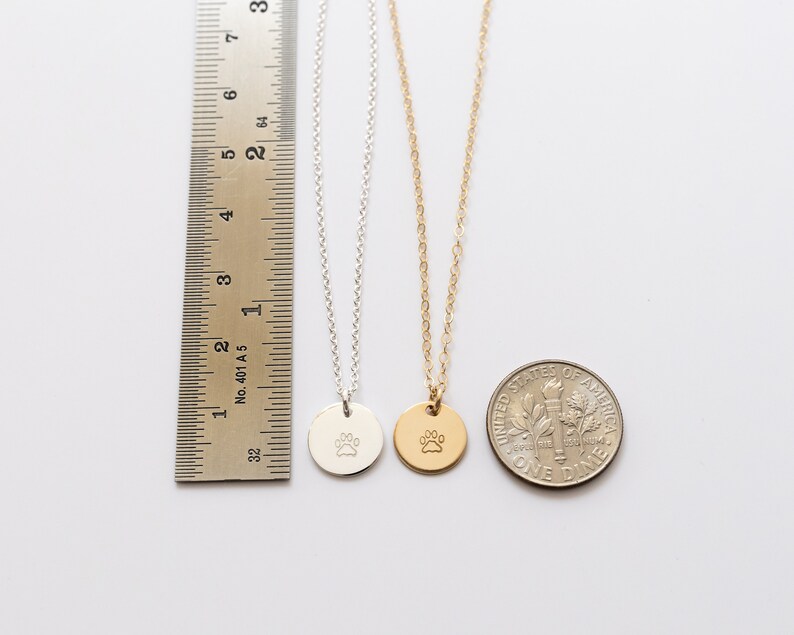 The necklaces are shown next to a ruler for size reference. The discs are about 9 mm in diameter (3/8 inch).