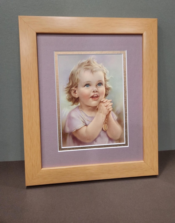 Little girl praying with a Miraculous Medal Necklace, custom-framed picture, Praying Bonella Milano