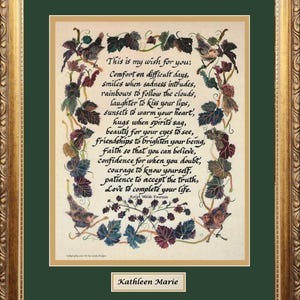 May include: A framed print with a gold ornate frame and a green mat. The print features a poem with calligraphy and illustrations of birds and leaves. The text reads "This is my wish for you..." and is signed "Kathleen Marie."