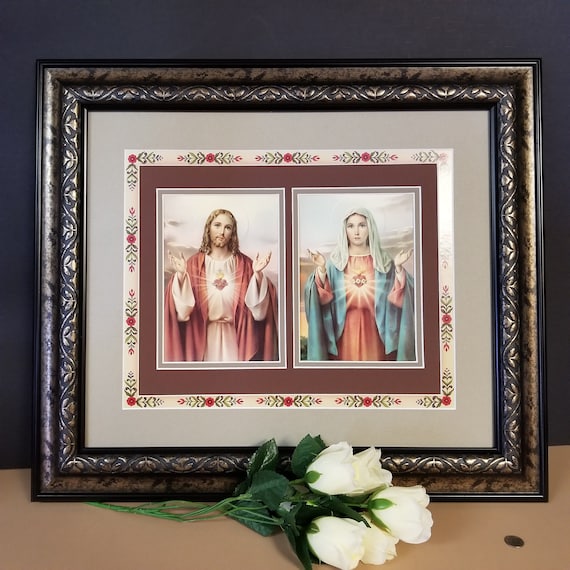 Sacred Heart of Jesus and Immaculate Mary prints beautifully framed picture with decorative floral border framed in gold and black frame.