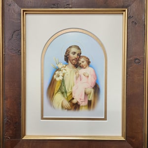 Saint Joseph and the child Jesus, framed and matted print.