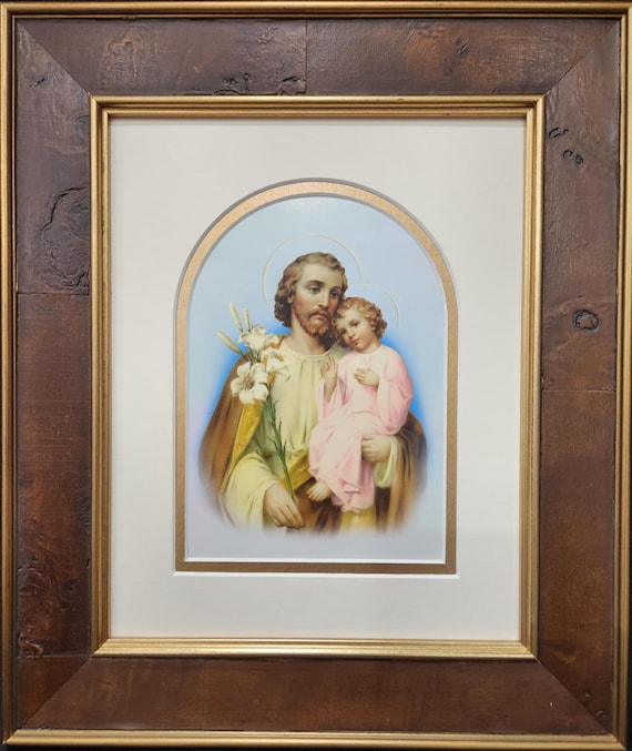 Saint Joseph and the child Jesus, framed and matted print.