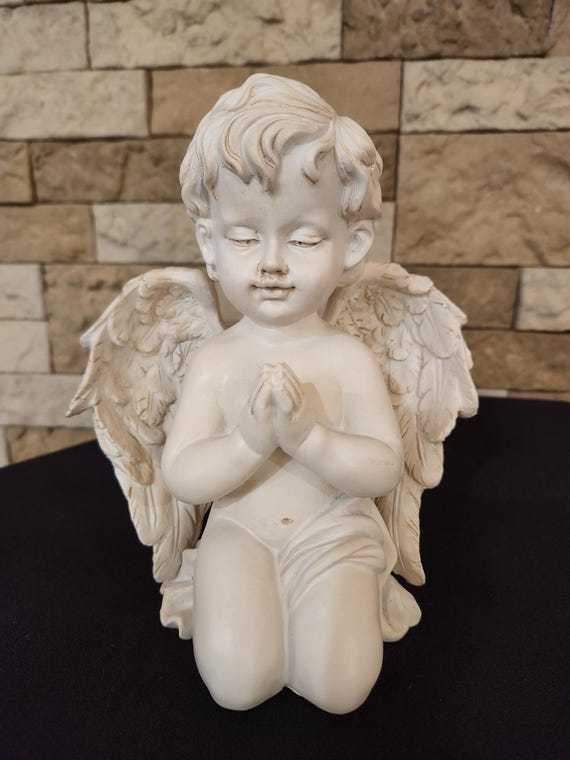 Praying cherub resin statue for yard, gift or home decor.