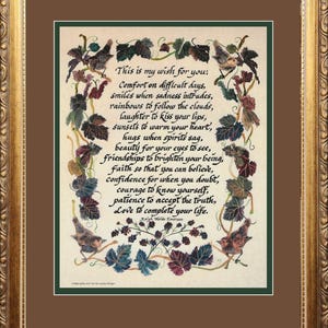 May include: A framed print with a gold ornate frame. The print features a handwritten poem with decorative leaves and birds. The poem's text begins with "This is my wish for you:" and is attributed to Ralph Waldo Emerson.