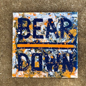 May include: A blue and orange abstract painting with the words "BEAR DOWN" in white letters.