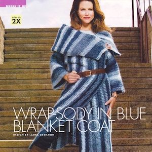 May include: A blue and white striped crochet blanket coat with a brown belt. The coat is styled with a wrap design and has a large collar. The text "WRAP-SODY IN BLUE BLANKET COAT" is printed below the model. The text "DESIGN BY LAURA GEBHARDT" is printed below the title.