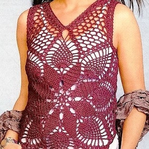 May include: A burgundy crochet top with a delicate openwork design. The top has a V-neck and sleeveless design.