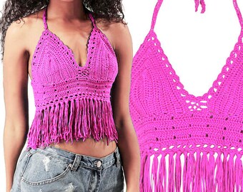 May include: A pink crochet halter top with fringe trim. The top is made of a lightweight, breathable fabric and has a relaxed fit.