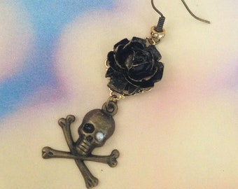 Earring sold has black rose and skull unit