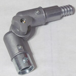 May include: A silver metal adjustable joint with a threaded end and a knob for tightening. The joint is designed to connect two pieces of pipe or tubing.