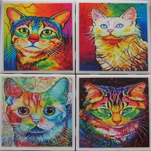 May include: Set of four colorful ceramic coasters featuring close-up images of cats with vibrant rainbow colors and abstract backgrounds.