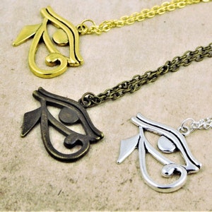 May include: Three necklaces with the Eye of Horus pendant in gold, bronze, and silver.