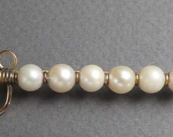 10Kt gold and natural pearls sword bar pin