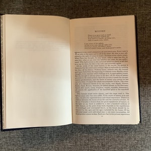 May include: A page from a book with the title "History" and text about the human mind and its connection to history. The text discusses the universality of the human mind and how each individual is a reflection of all history.
