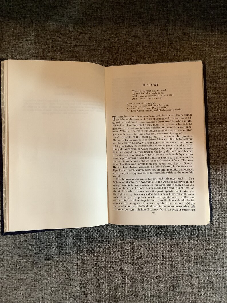 May include: A page from a book with the title "History" and text about the human mind and its connection to history. The text discusses the universality of the human mind and how each individual is a reflection of all history.