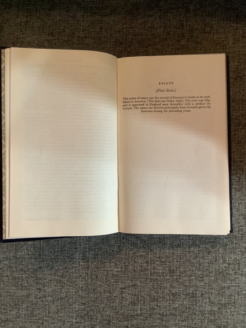 May include: A book titled "Essays (First Series)" by Ralph Waldo Emerson. The book was first published in 1841 and includes essays derived from lectures given by Emerson in the years prior.