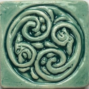 Set 2. Four Wee Tiny bas relief tiles (2&quot;) in four different designs and colours