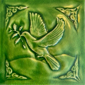 Handmade Celtic Dove of peace Ceramic bas relief tile in a crackle green