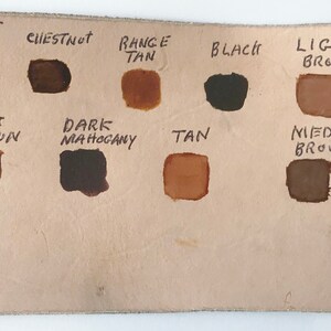 May include: Leather color chart with 12 different shades of brown, tan, black, and antique dark brown finish. The colors are labeled with names like Java Brown, Desert Tan, Chestnut, Range Tan, Black, Light Brown, Acorn Brown, Dark Brown, Dark Mahogany, Tan, Medium Brown, and Antique Dark Brown Finish.