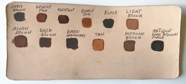 May include: Leather color chart with 12 different shades of brown, tan, black, and antique dark brown finish. The colors are labeled with names like Java Brown, Desert Tan, Chestnut, Range Tan, Black, Light Brown, Acorn Brown, Dark Brown, Dark Mahogany, Tan, Medium Brown, and Antique Dark Brown Finish.
