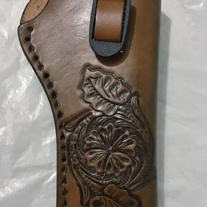 Hand tooled leather revolver holster-medium- Made in Montana(adjustable strap, custom designs)