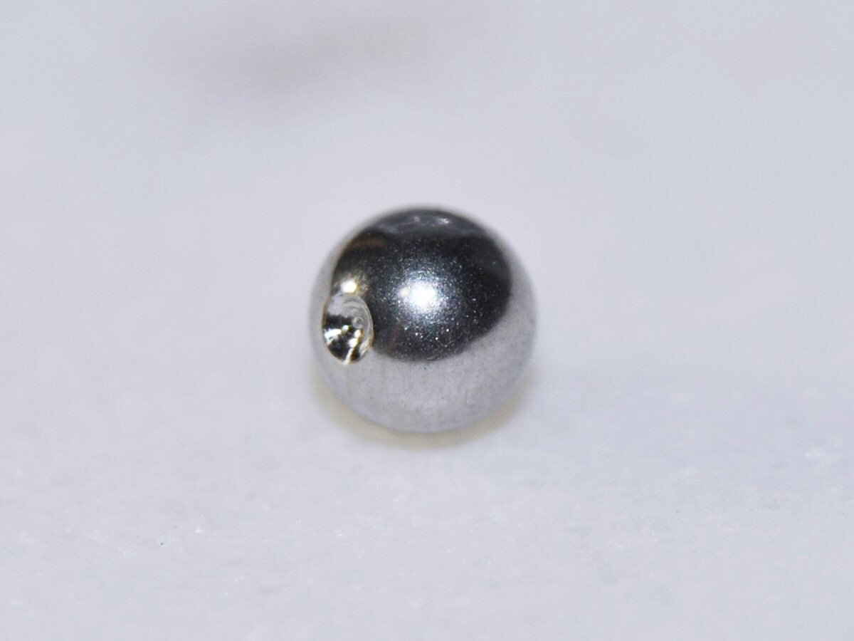 316L Surgical Steel Winged Skull And Crossbones Captive Bead Ring
