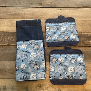 North Carolina Tar Heels themed 3 piece kitchen gift set.