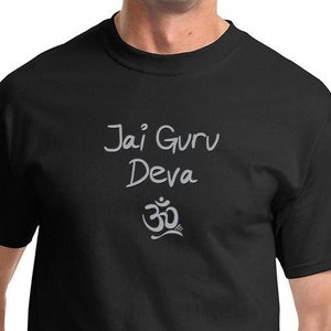 May include: Black t-shirt with the text "Jai Guru Deva" and an Om symbol in white.