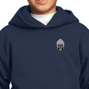 May include: A navy blue hooded sweatshirt with a small white Buddha face graphic on the left chest pocket.