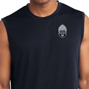 May include: A navy blue sleeveless shirt with a white embroidered Buddha face on the front.