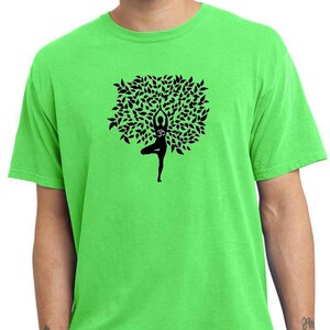 May include: A bright green t-shirt with a black silhouette of a person in a yoga pose, forming the shape of a tree with leaves.