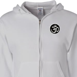 May include: White zippered hoodie with a black Om symbol on the left chest.