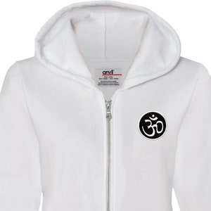 May include: White zippered hoodie with a black Om symbol on the left chest. The hoodie has a drawstring hood and two front pockets.