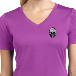 May include: A purple v-neck t-shirt with a black and white Buddha face graphic on the left chest.