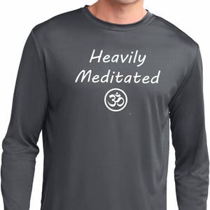 May include: A dark grey long-sleeved shirt with the text "Heavily Meditated" and an Om symbol in white.
