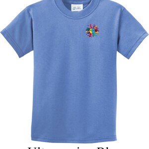 May include: A light blue t-shirt with a colorful sun graphic on the left chest. The graphic features a yellow sun with a smiling face and colorful rays.