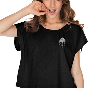 May include: Black cropped t-shirt with a white Buddha graphic on the front.