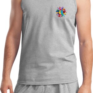 May include: A gray tank top with a colorful sun design on the left chest pocket. The sun is made up of multiple colorful lines and has a blue and yellow face.