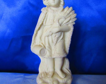 Victorian White Bisque Figure Holding Ears of Wheat, Scythe in One Arm and a Casket in the Other