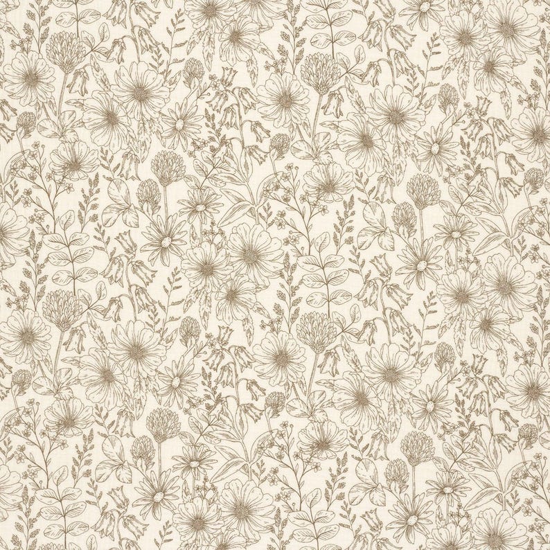 May include: A cream-colored fabric with a detailed floral pattern. The design features various flowers, leaves, and stems in a light brown color, creating a natural and botanical theme. The pattern is evenly distributed across the fabric.